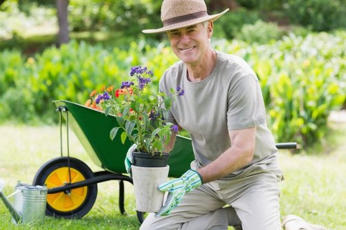 Crew using protective equipment while operating gardening machinery